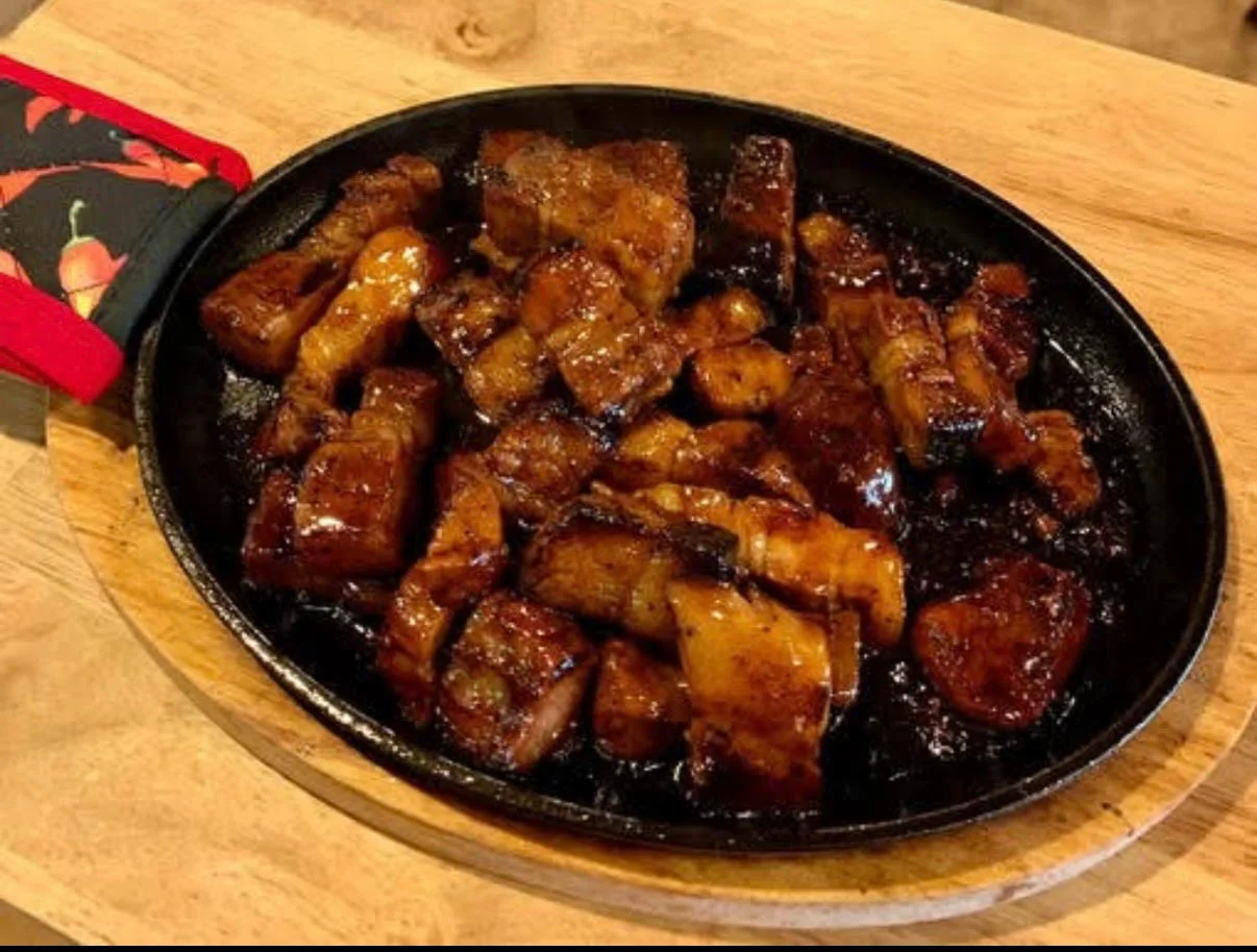 Sizzling pork on cast iron